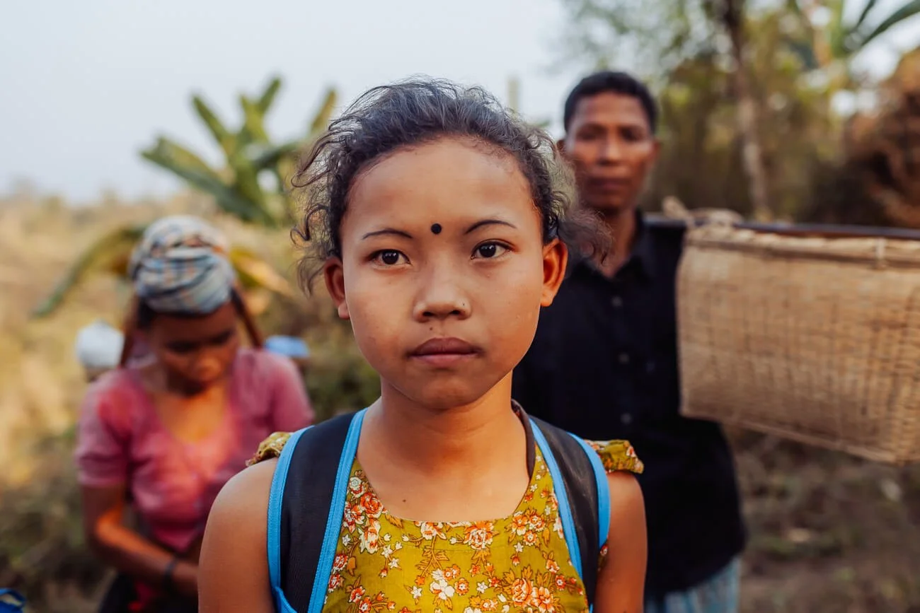 Chakma girl returns from the fields with her parents in the Chittagong Hill Tracts.