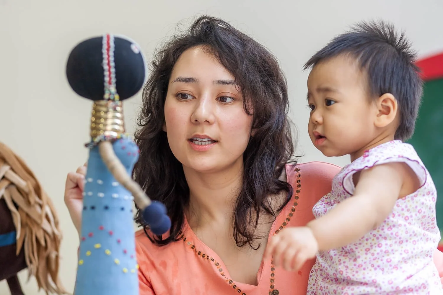 Traditional Montessori globes and geography materials featured in a Hong Kong kindergarten window.