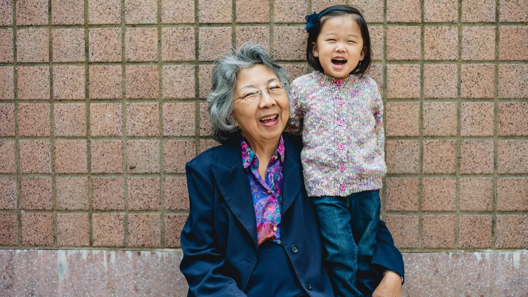 Grandmother and granddaughter on a photoshoot in Kowloon, Hong Kong