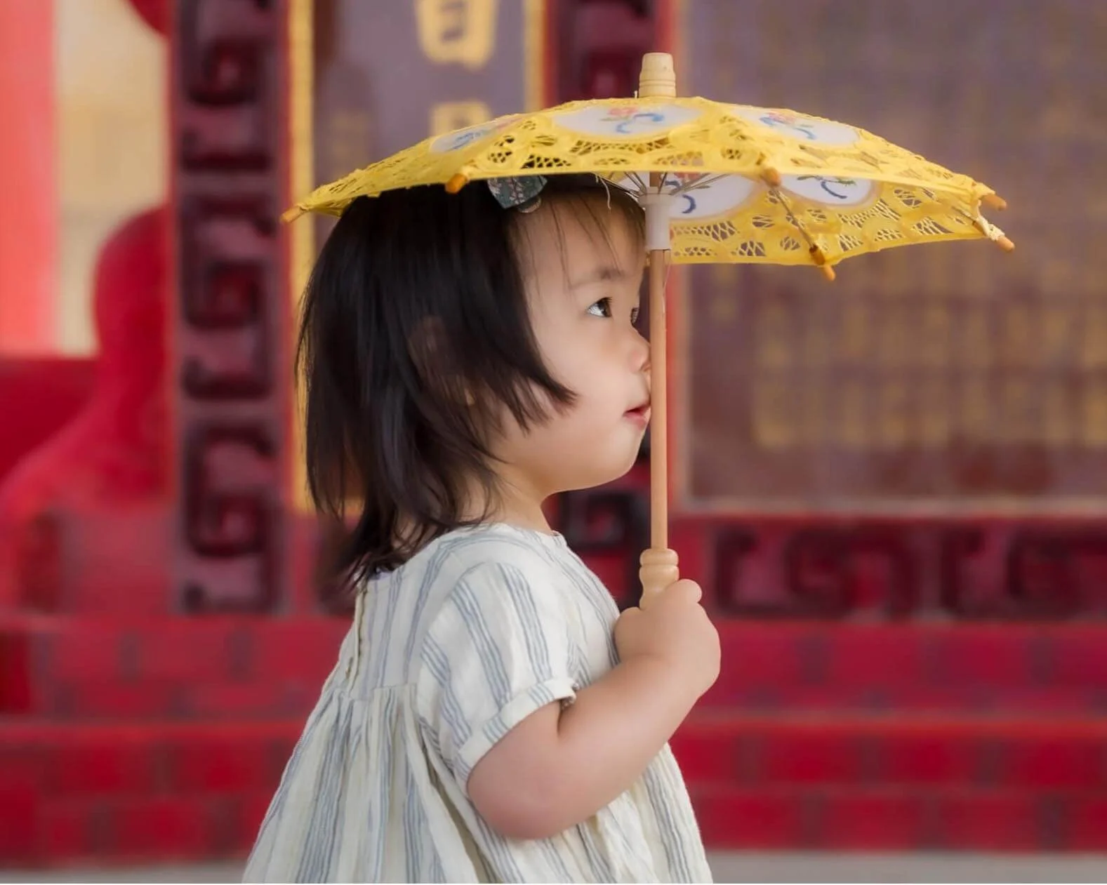 Girl with parasol at Repulse Bay Beach Hong Kong