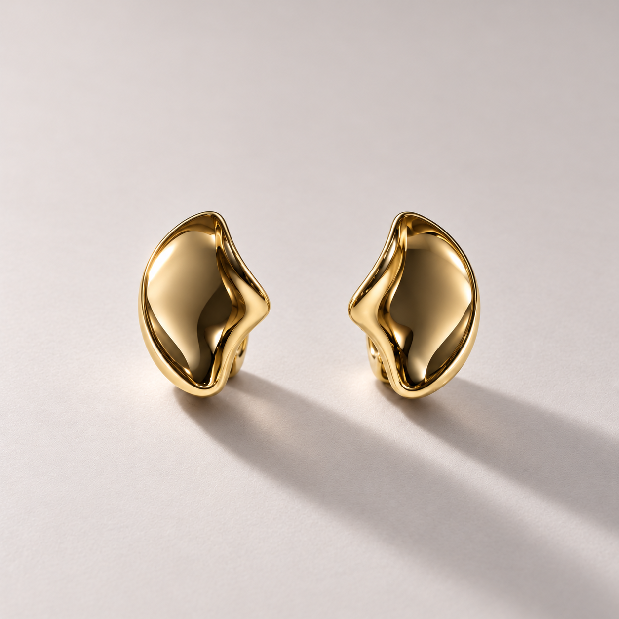 Sculptural Yellow Gold Earrings on Warm Grey-1.png