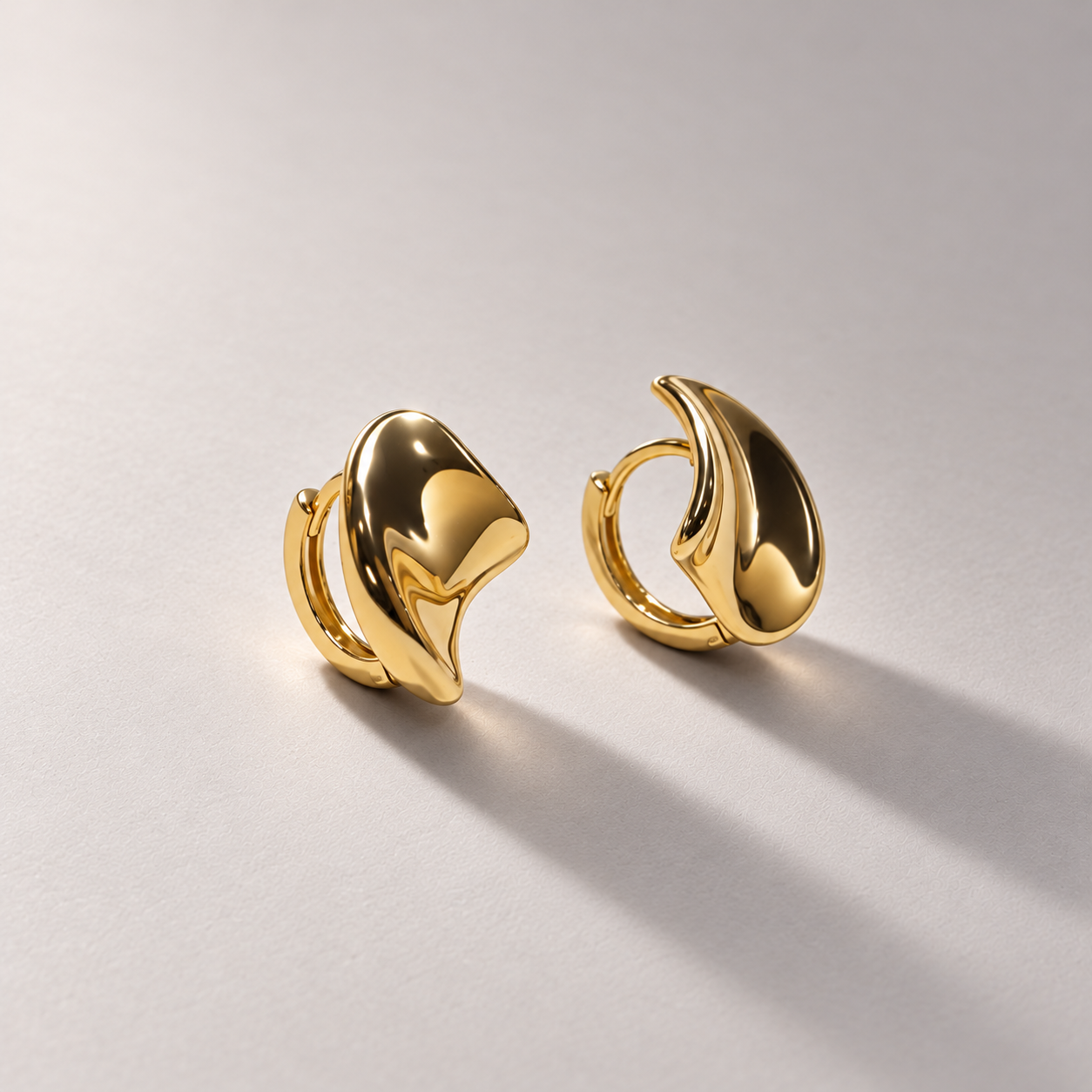 Sculptural organic yellow gold earrings-3.png