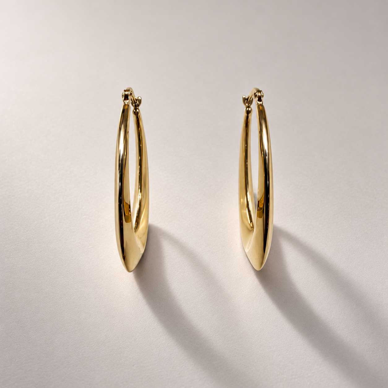 Elongated Yellow Gold Hoop Earrings-3.png