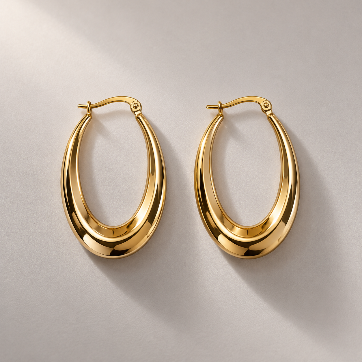 Graduated Yellow Gold Oval Hoop Earrings-2.png