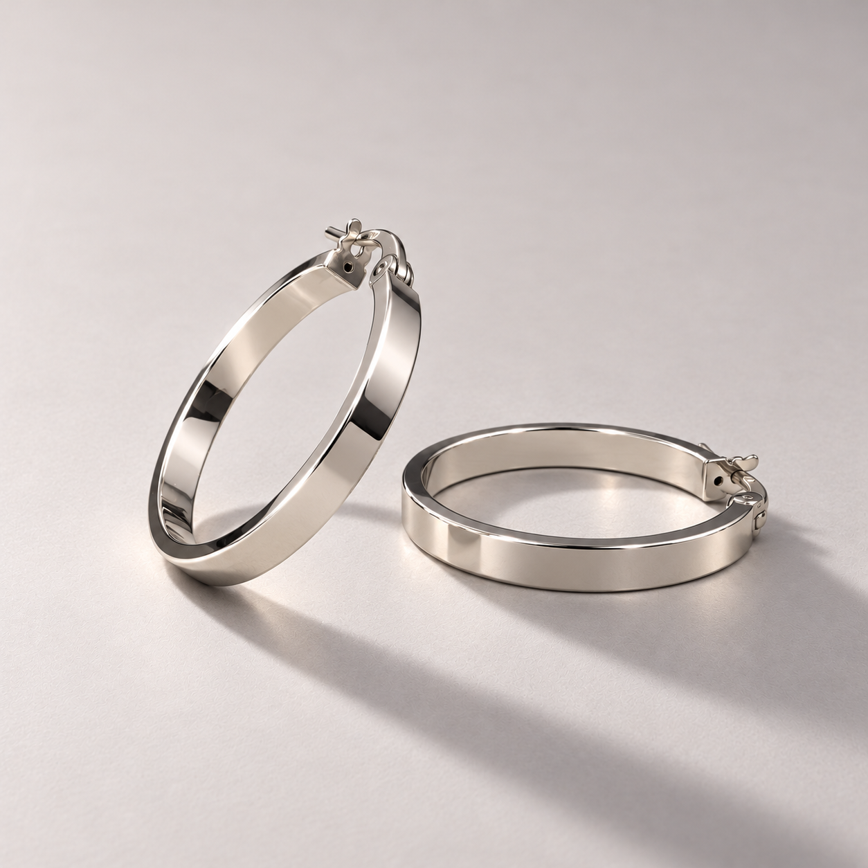 Polished white gold hoop earrings-4.png