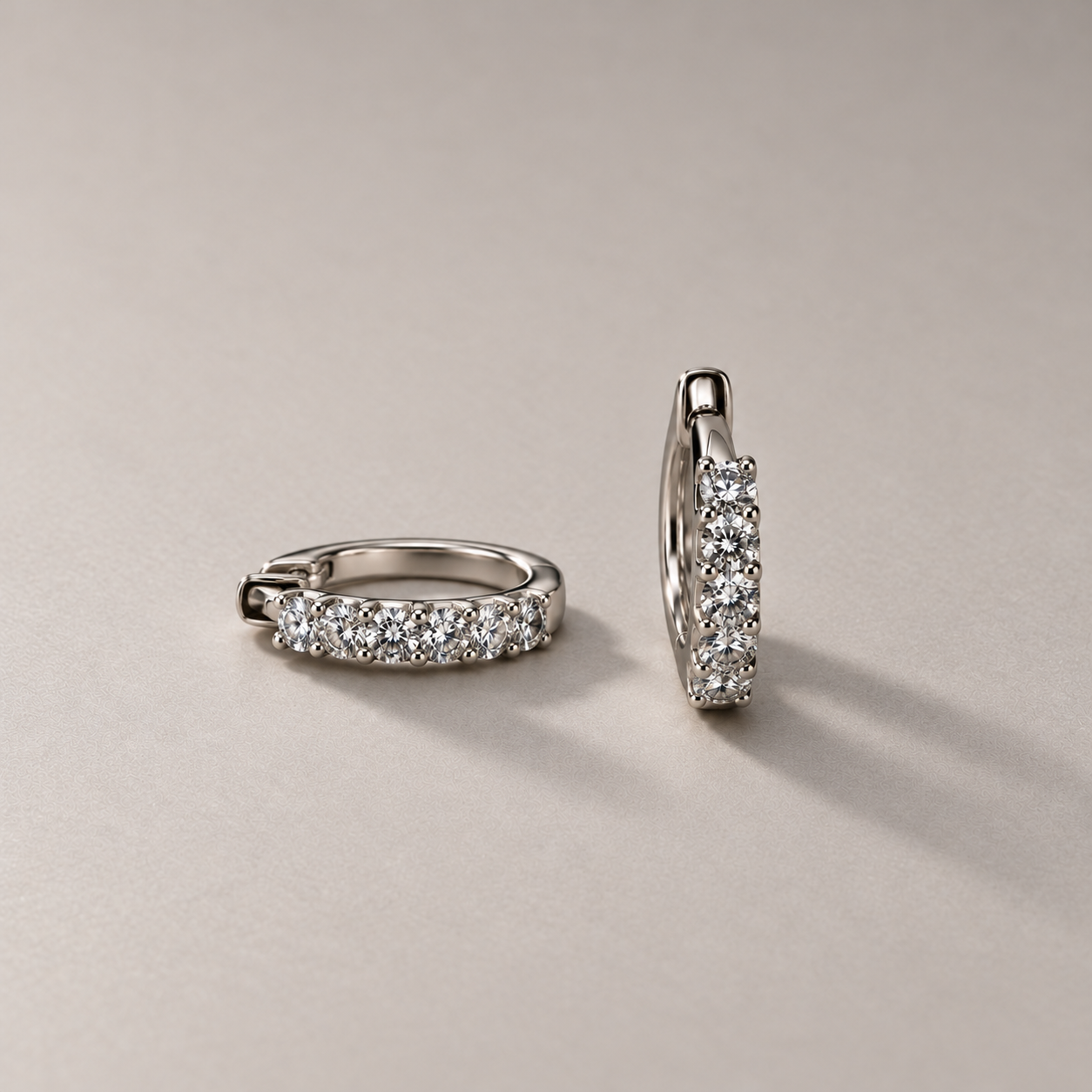 White gold diamond huggie pair.png