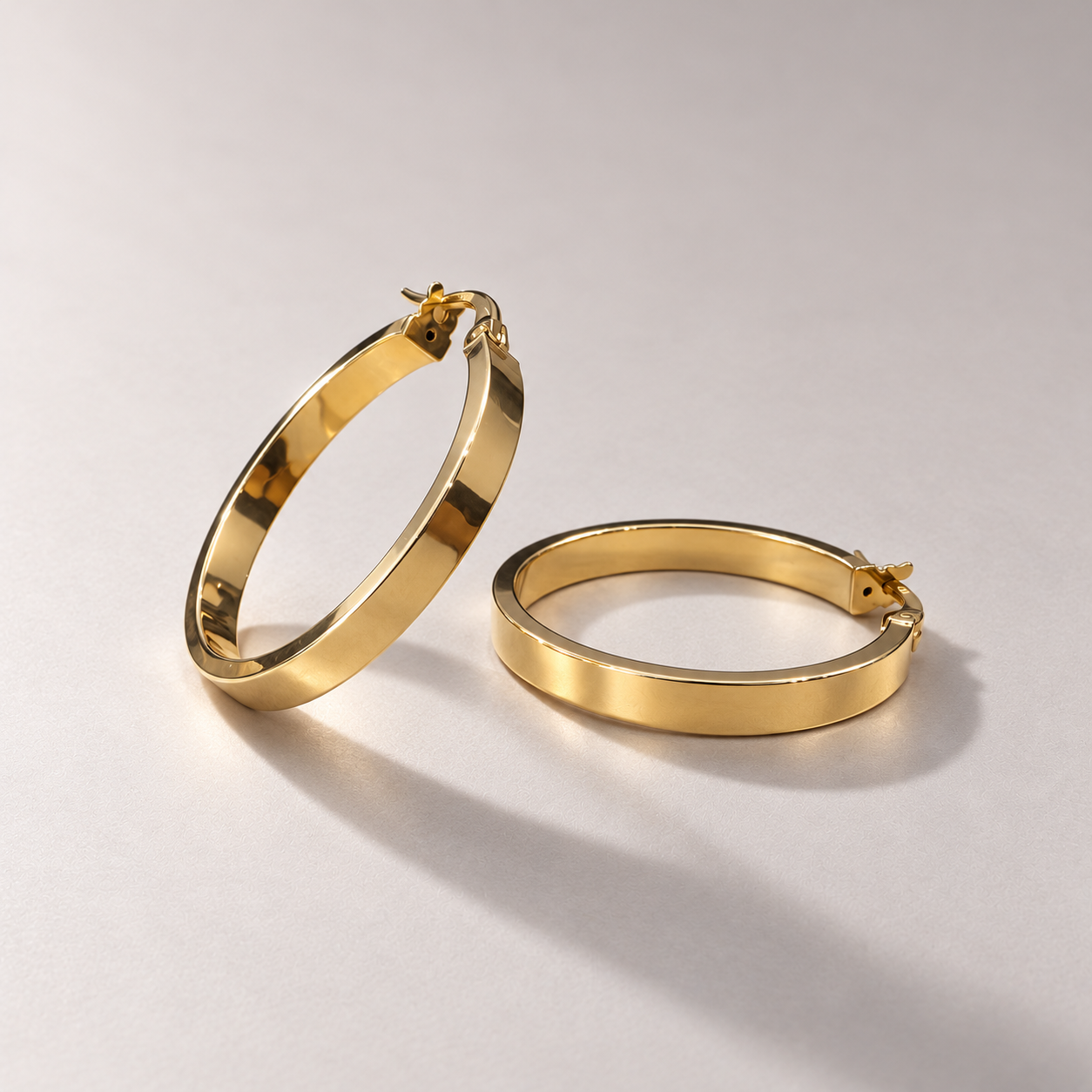 Polished gold hoop earrings-2.png