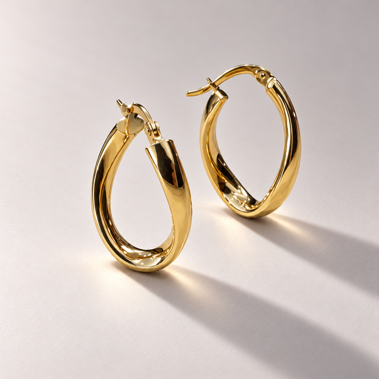 Polished twisted gold hoop earrings-3.png
