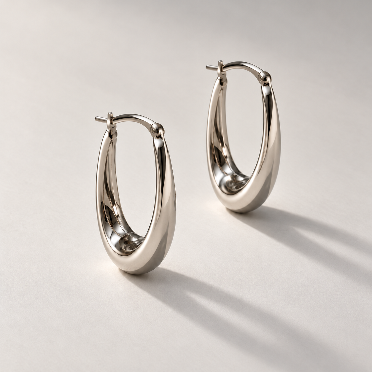 White gold hoops with hinged clasps.png