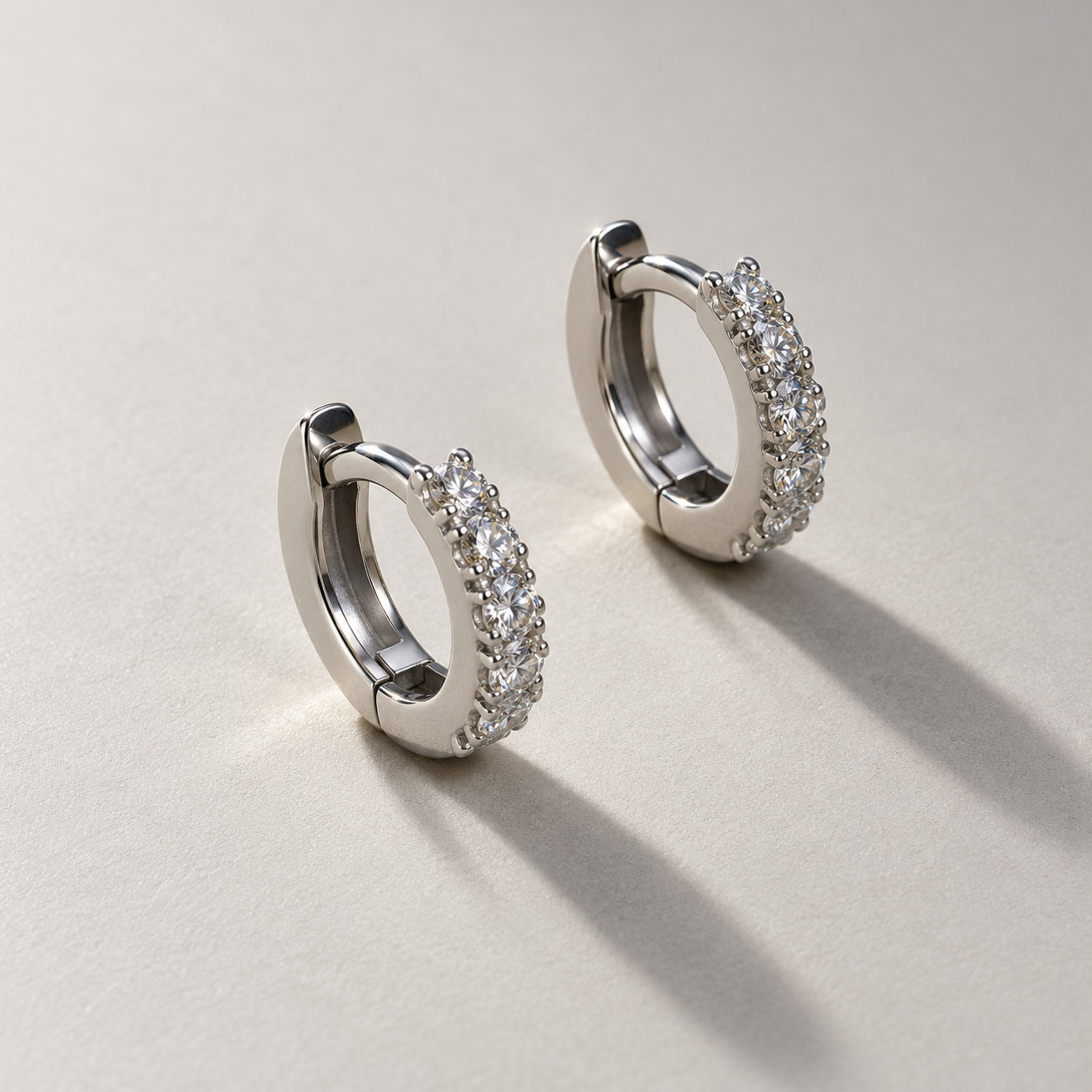 Matching White Gold Diamond Huggie Hoops.png