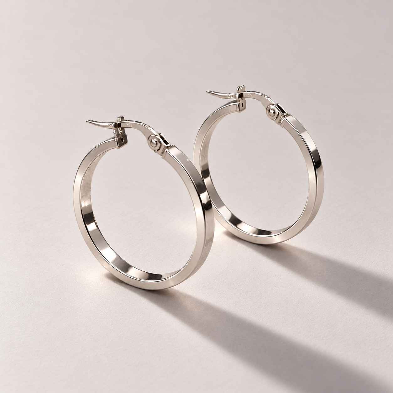 Polished white gold hoop earrings-3.png