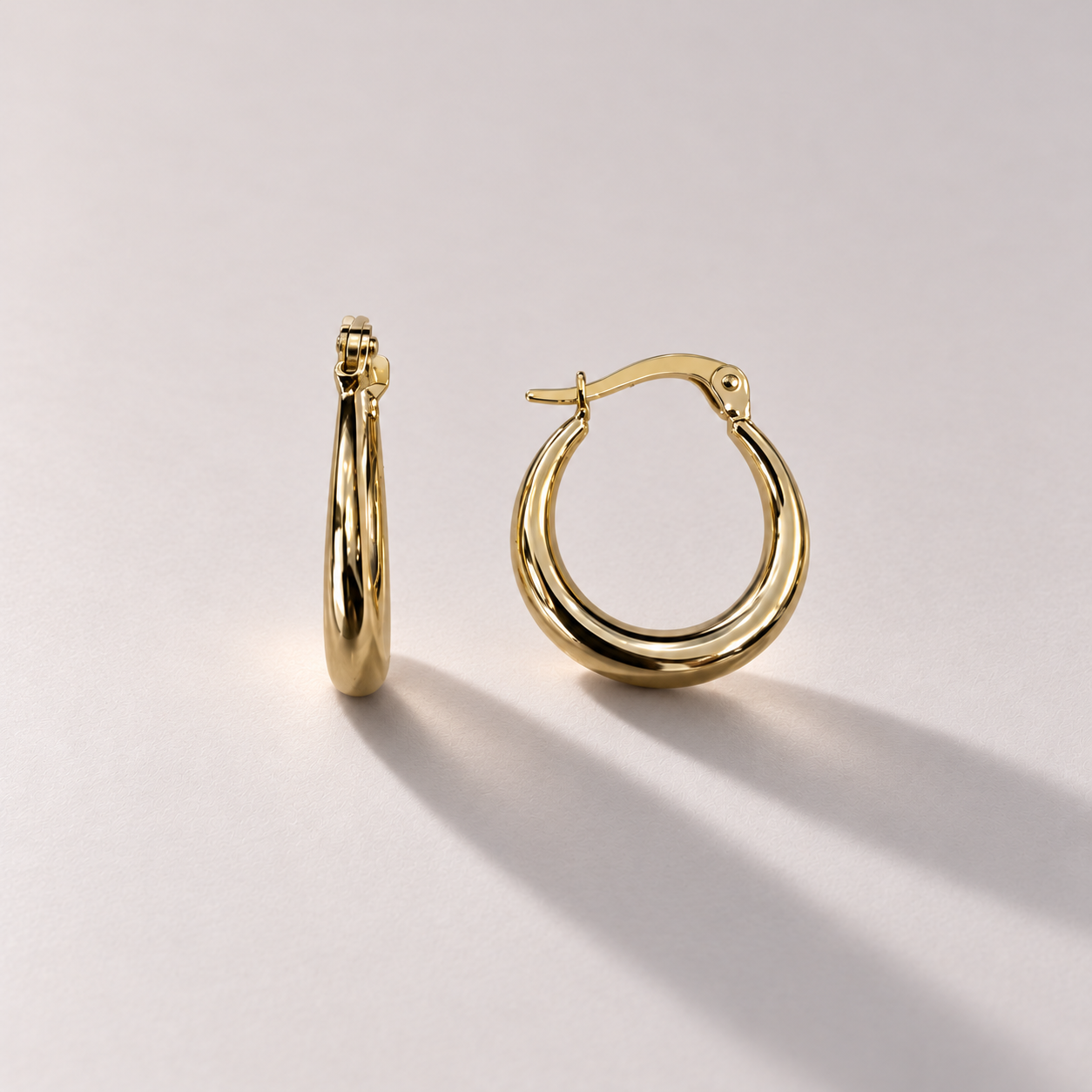 Yellow gold graduated hoop earrings-2.png