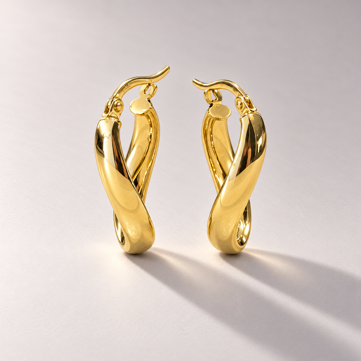 Twisted Gold Oval Hoop Earrings-1.png