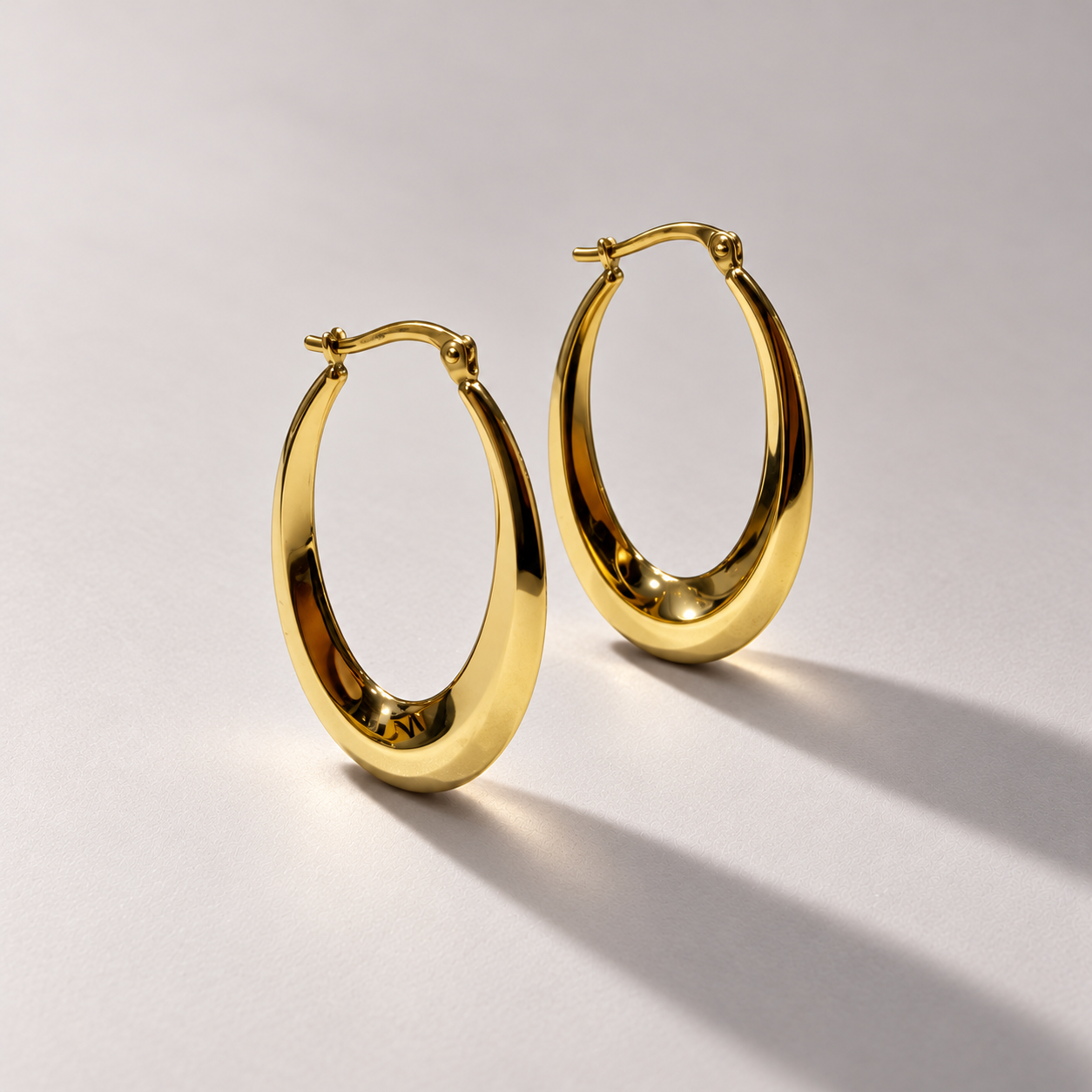 Luxury yellow gold oval hoops-1.png