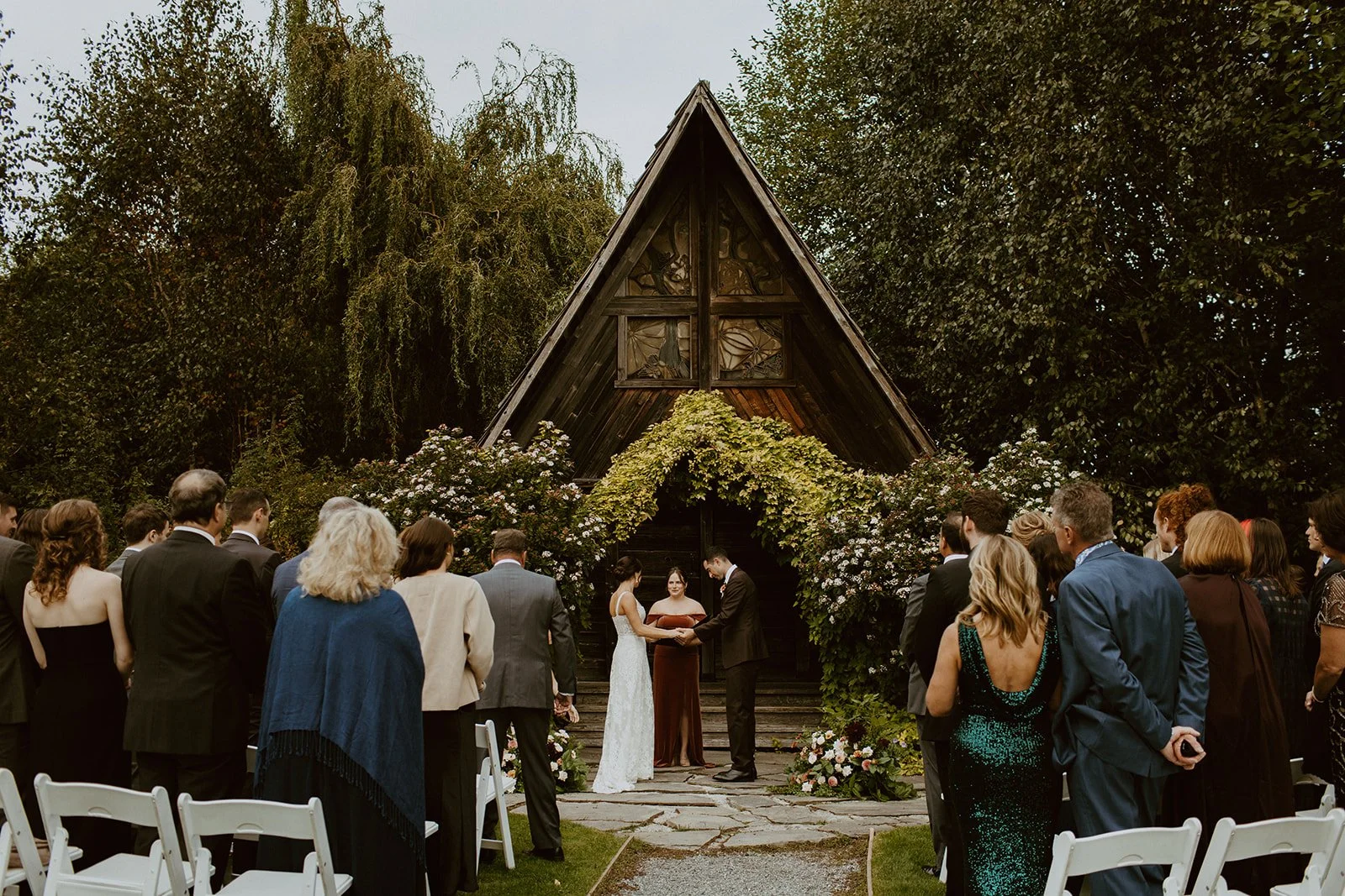 Garden wedding ceremony in front of an A-frame cabin in Washington