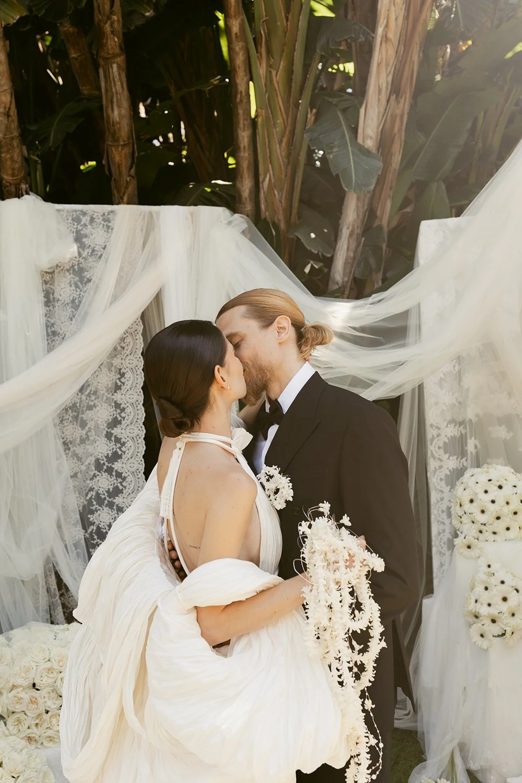 Bride and groom kiss at the altar of their Italy wedding venue: Villa Astor