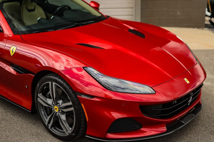 Coated Ferrari paint holding gloss in direct sunlight at Ascension Automotive