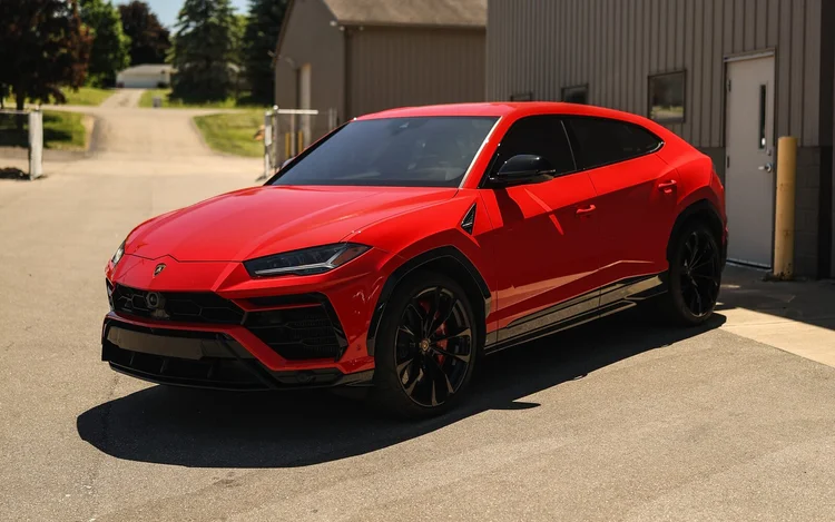 Red Lamborghini Urus with ceramic window tint at Ascension Automotive