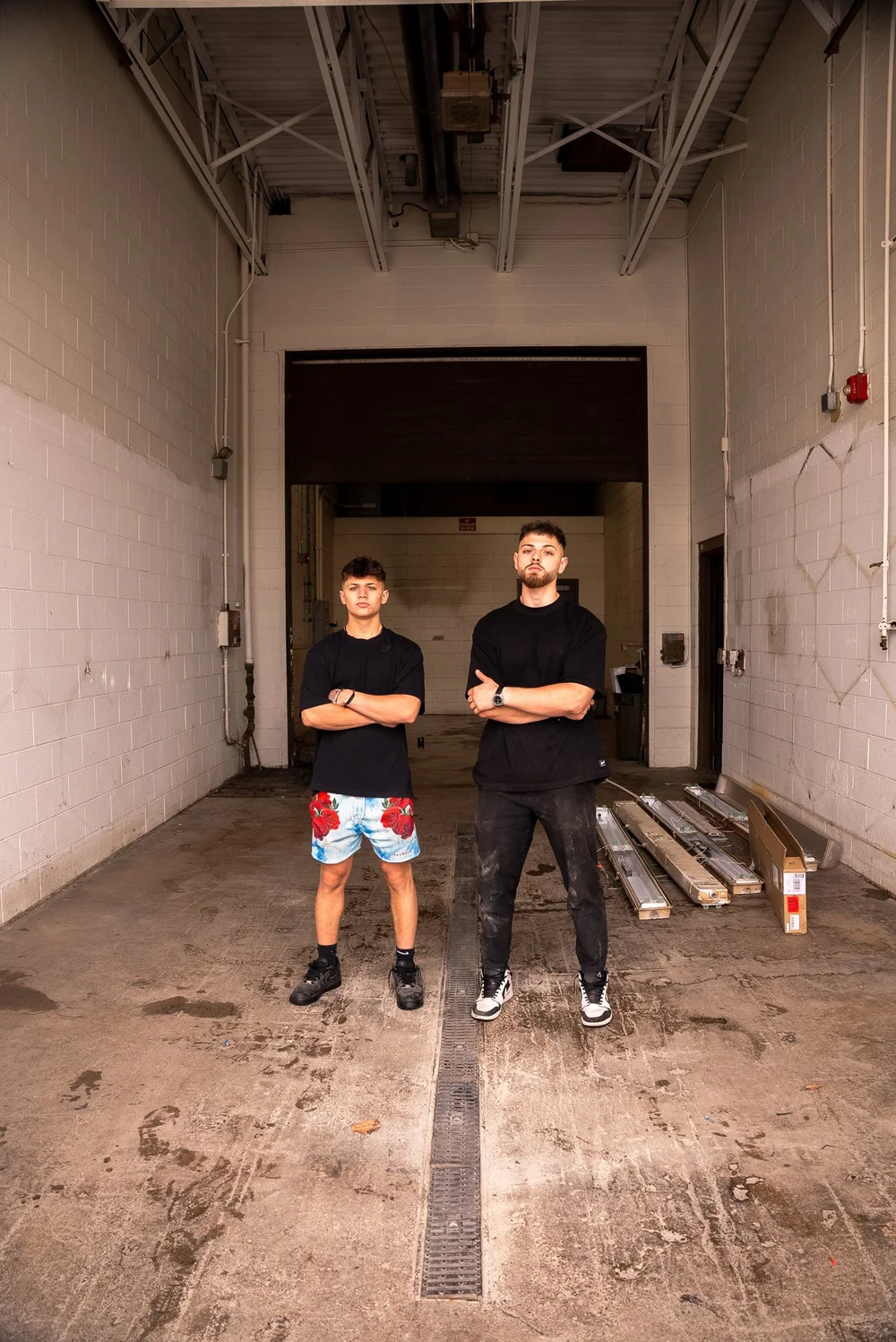 David and Elie Alam standing inside the empty brick warehouse where Ascension Automotive began