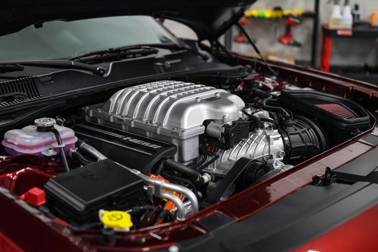 Supercharged Dodge Hellcat engine bay after an engine bay detail at Ascension Automotive in Milford, Michigan