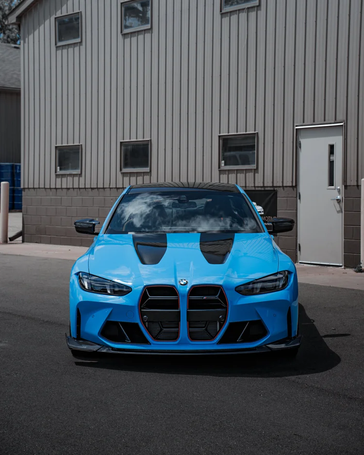 Blue BMW M4 photographed after a full detail at Ascension Automotive in Milford, Michigan