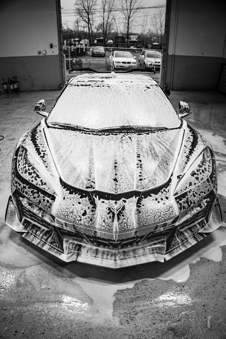 Chevrolet Corvette C8 Z06 covered in foam during a full detail at Ascension Automotive