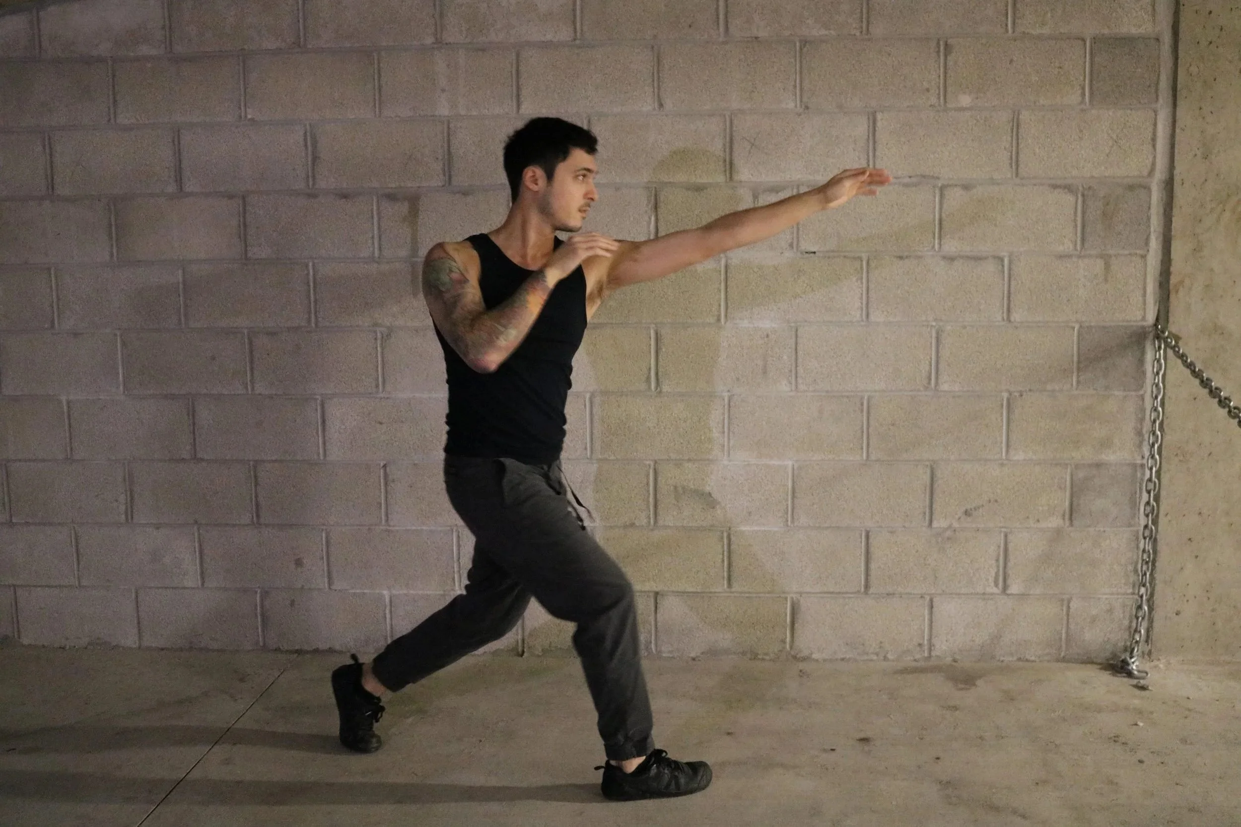 Powerful punch image of nic buttice outside against wall