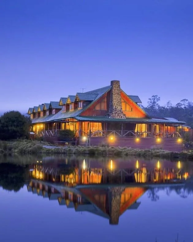 a luxury event lodge on the mountain at night