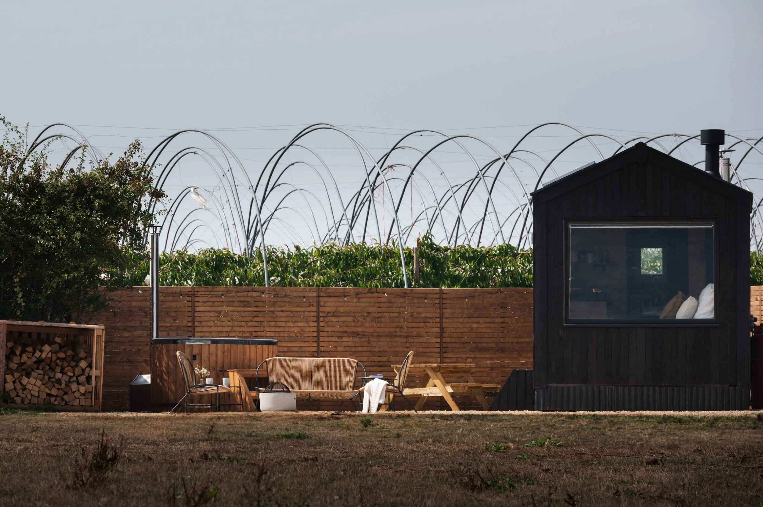 Stylish black-clad tiny house – the perfect retreat.
