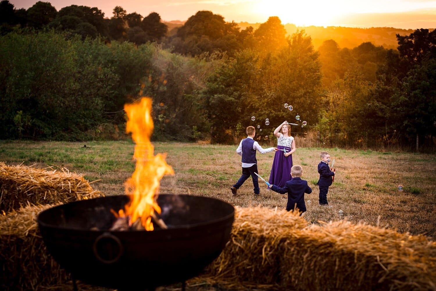 Kids playing at a wedding at the Welsh Green Weddings venue in Carmarthenshire. Image by Real and Rich Photography.