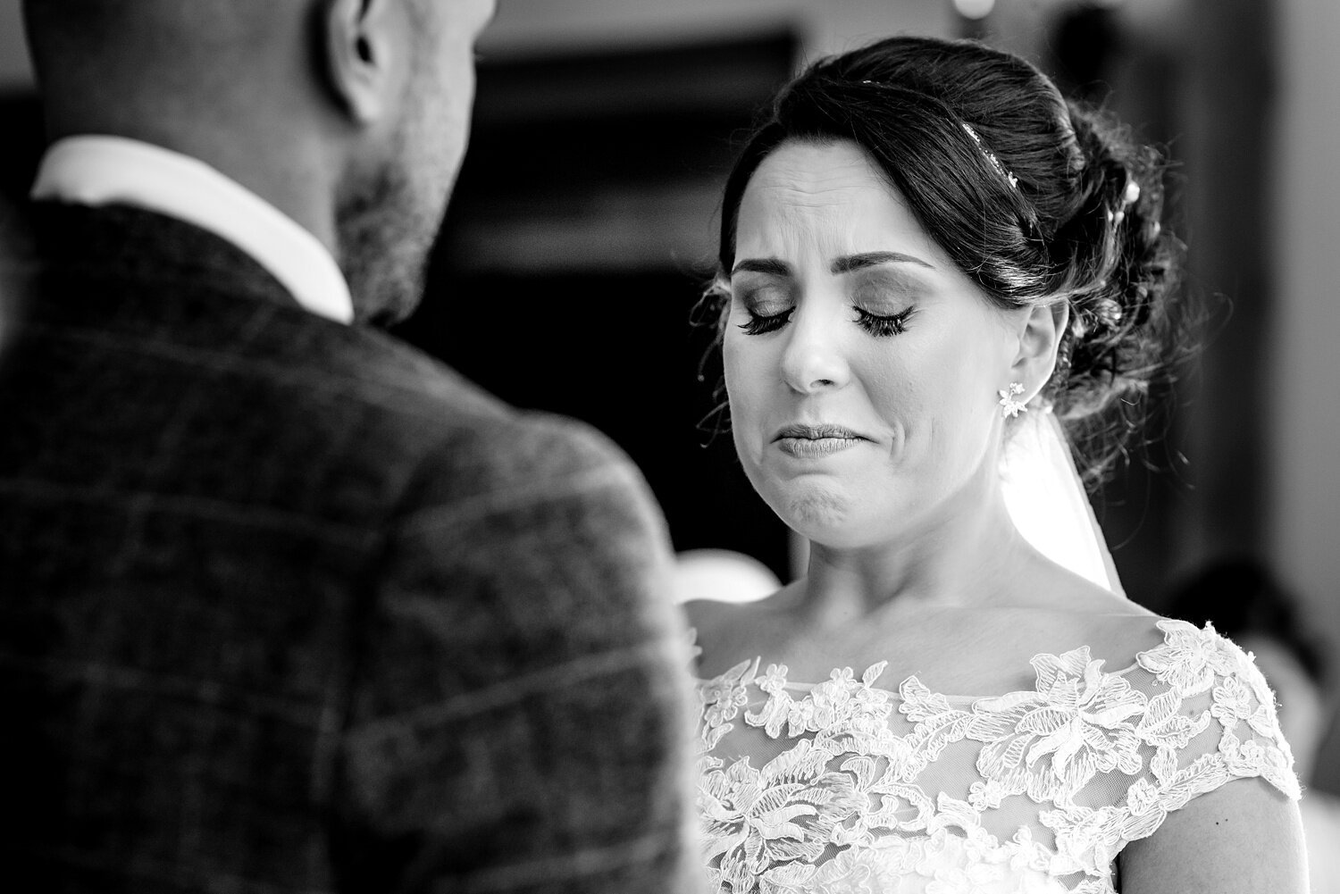 Bride holds back tears at Oldwalls Gower wedding. Wedding photography by Rich Williams of Real and Rich Photography.