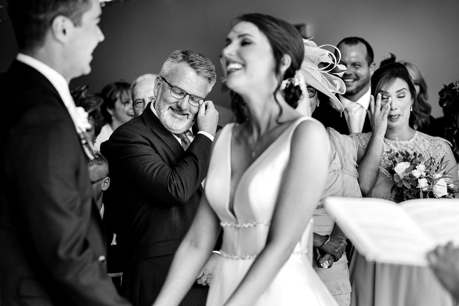 Guests shed a tear at Llanerch Vineyard wedding ceremony.
