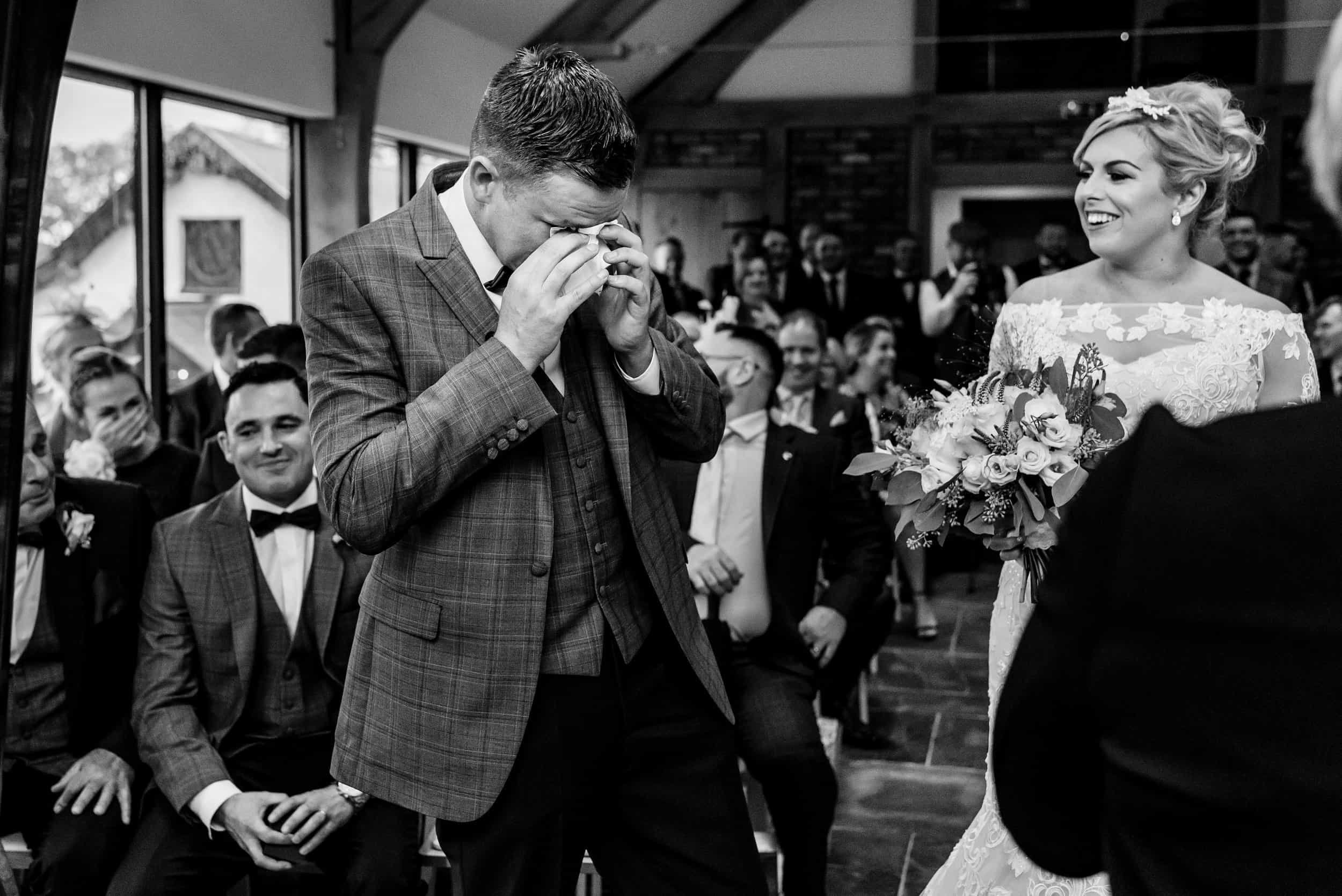 Wedding ceremony at Carreg Cennen Castle by Real and Rich Photography, a Carmarthenshire-based Wedding Photographer.
