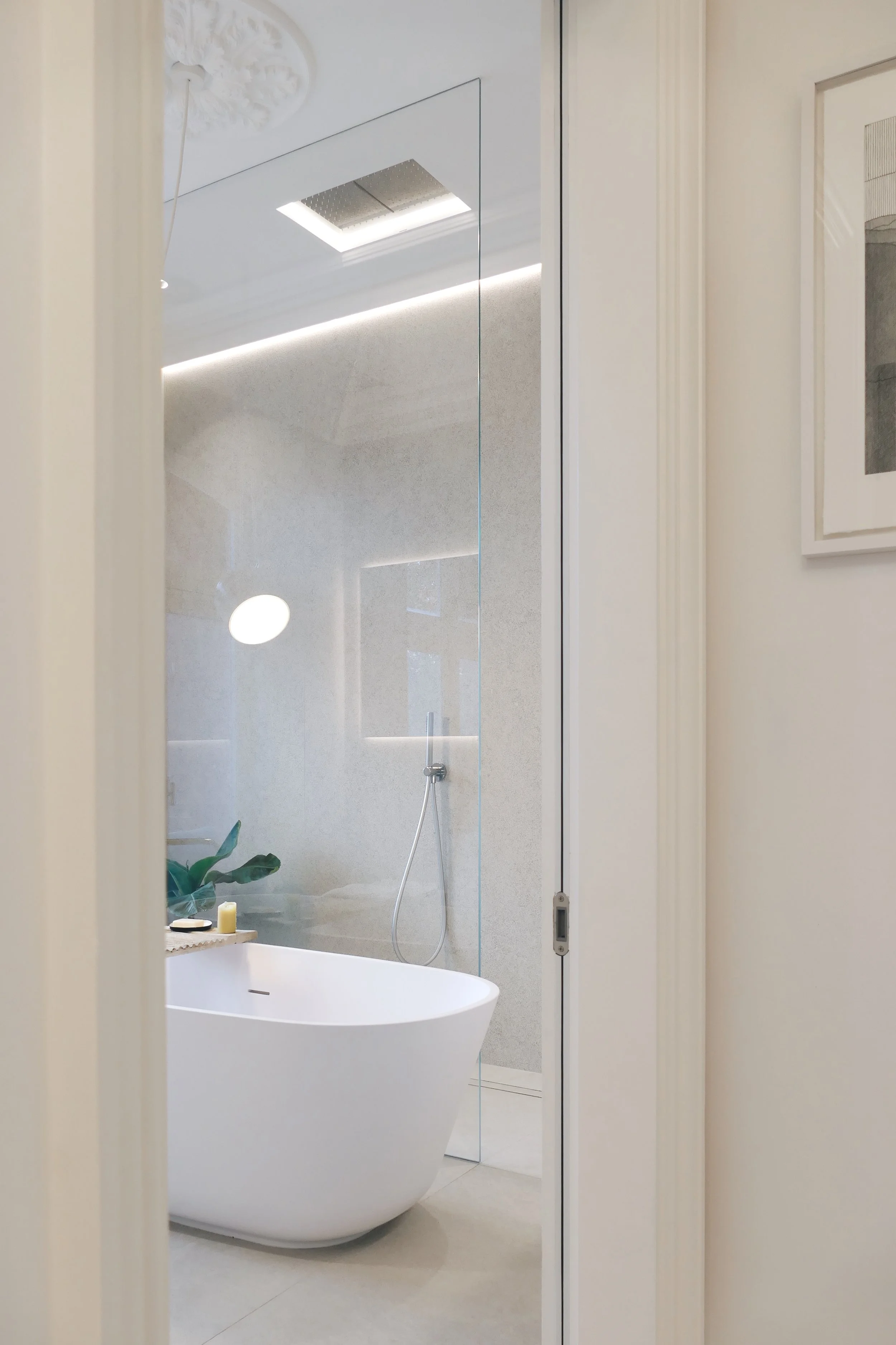 Antonio Lupi Baia freestanding bathtub in a luxury bathroom setting at the Abitalia South Coast showroom in Dorset, UK.