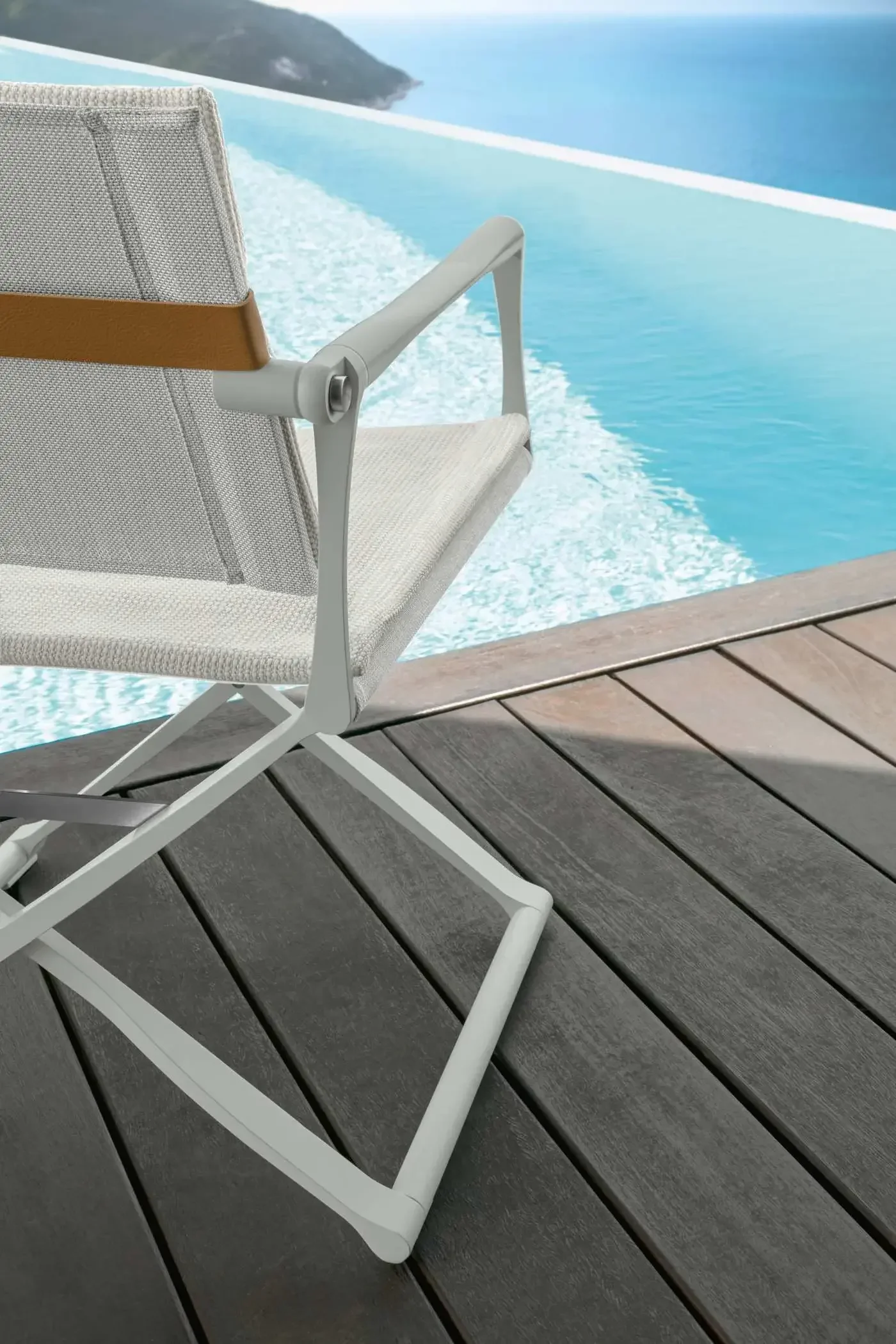 Sleek aluminium frame paired with plush, textured cushions.