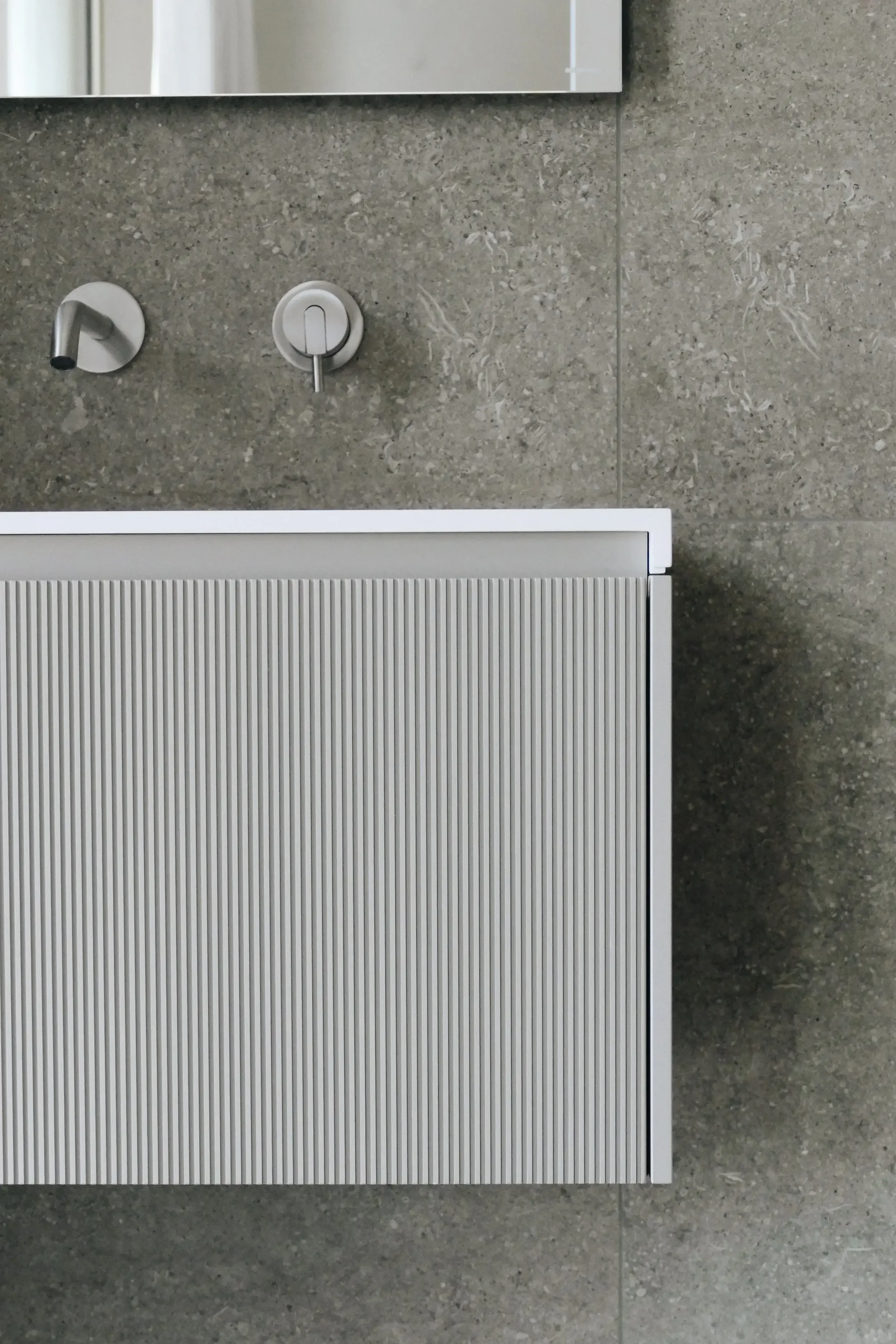 Florim tiles installed on an Antonio Lupi bathroom basin in a luxury bathroom by Abitalia South Coast in Dorset.