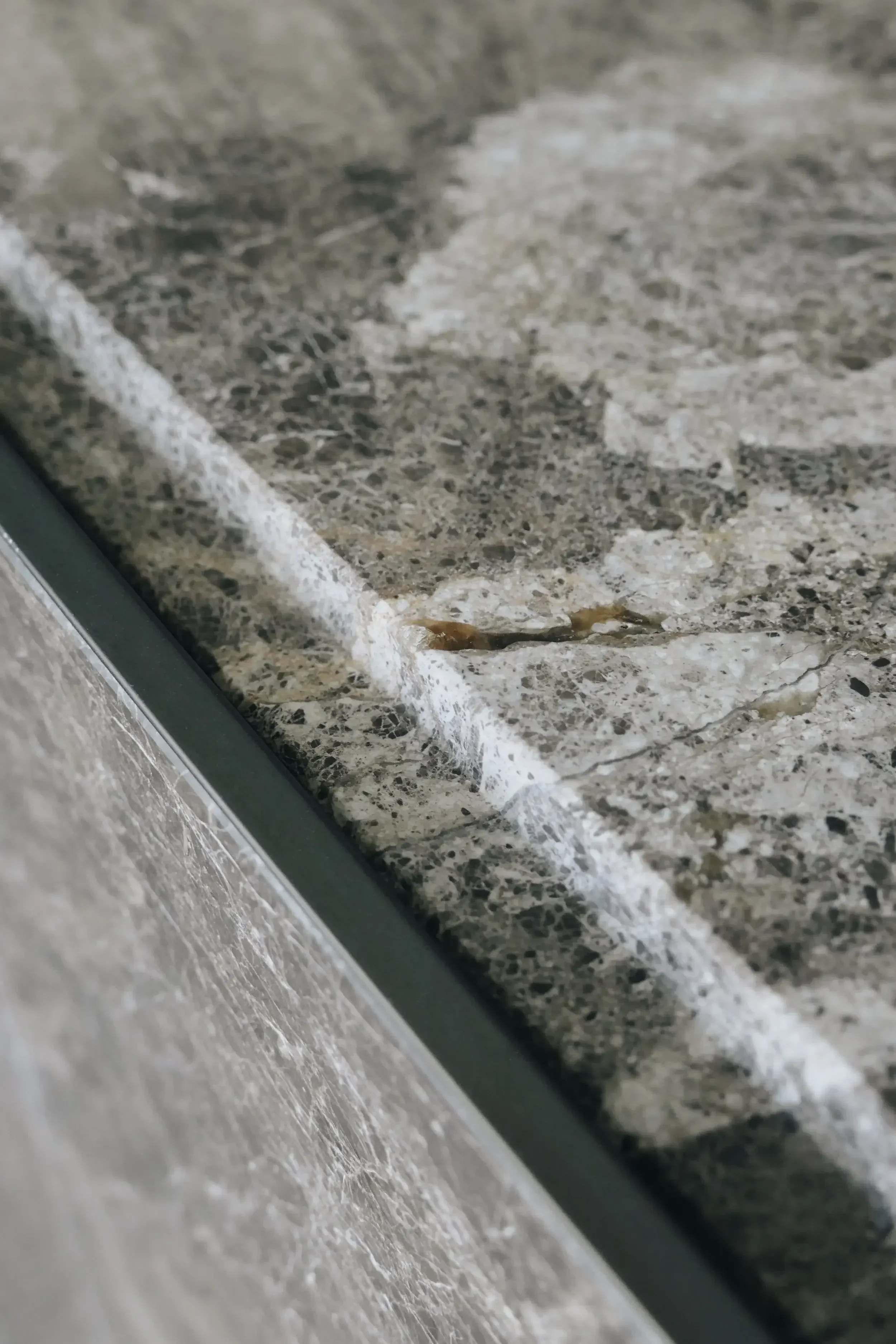 Detailed view of premium marble or porcelain kitchen worktop finishes by luxury brands in the market.