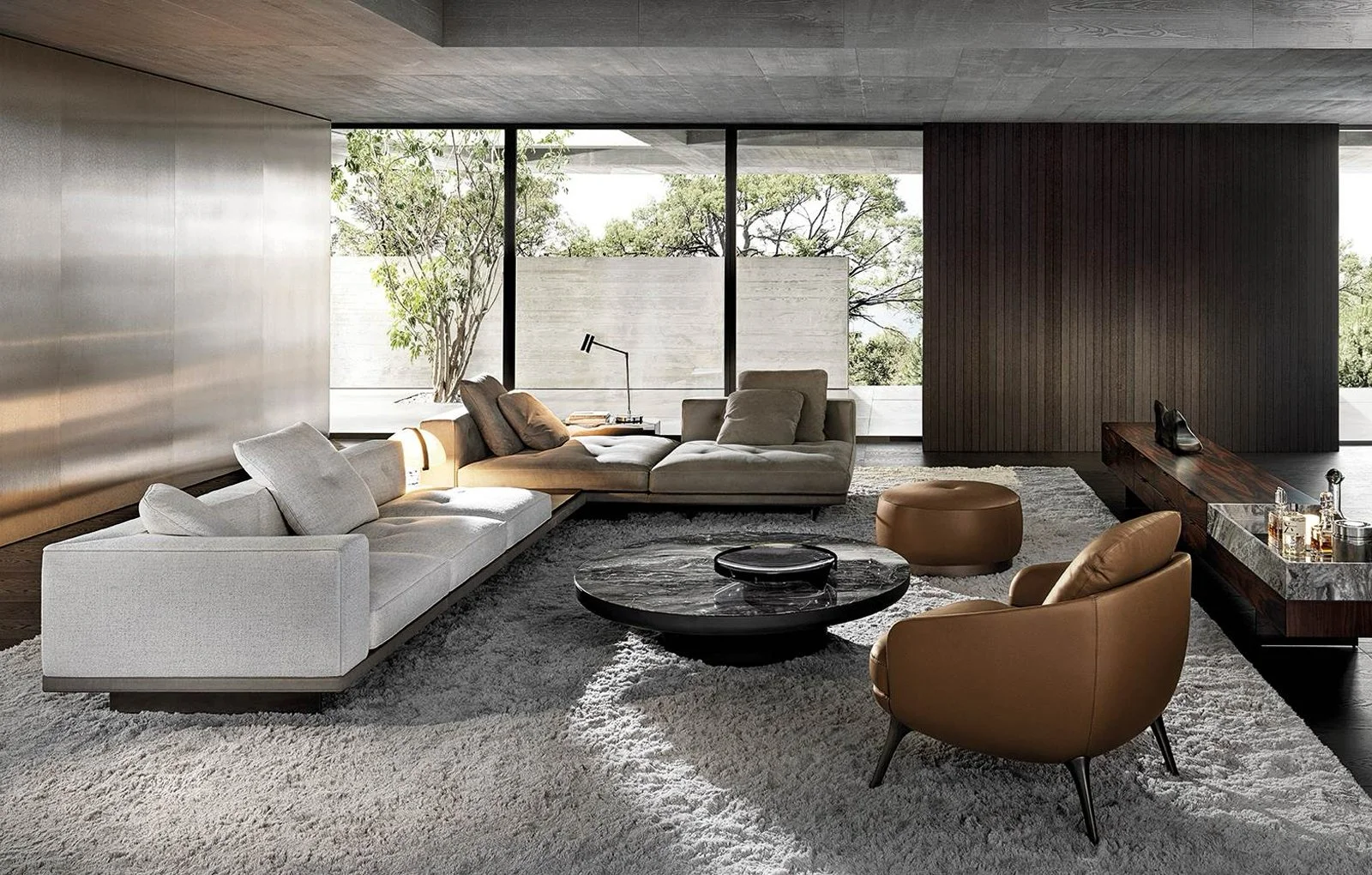 Minotti Dylan sofa composition with white and beige sofa, brown leather armchair, and black porcelain coffee table, designed by Abitalia South Coast in Poole, Dorset, UK.