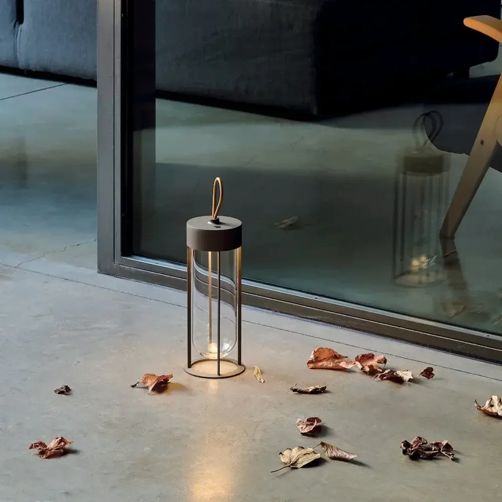 Flos In Vitro Unplugged portable and rechargeable table lamp designed by Philippe Starck, supplied by Abitalia South Coast in Dorset, Hampshire, and Surrey.