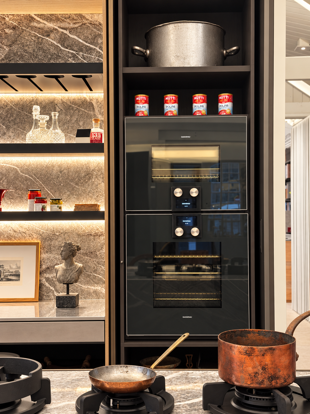 Luxury Kitchen with Marble Shelving and Ovens.png