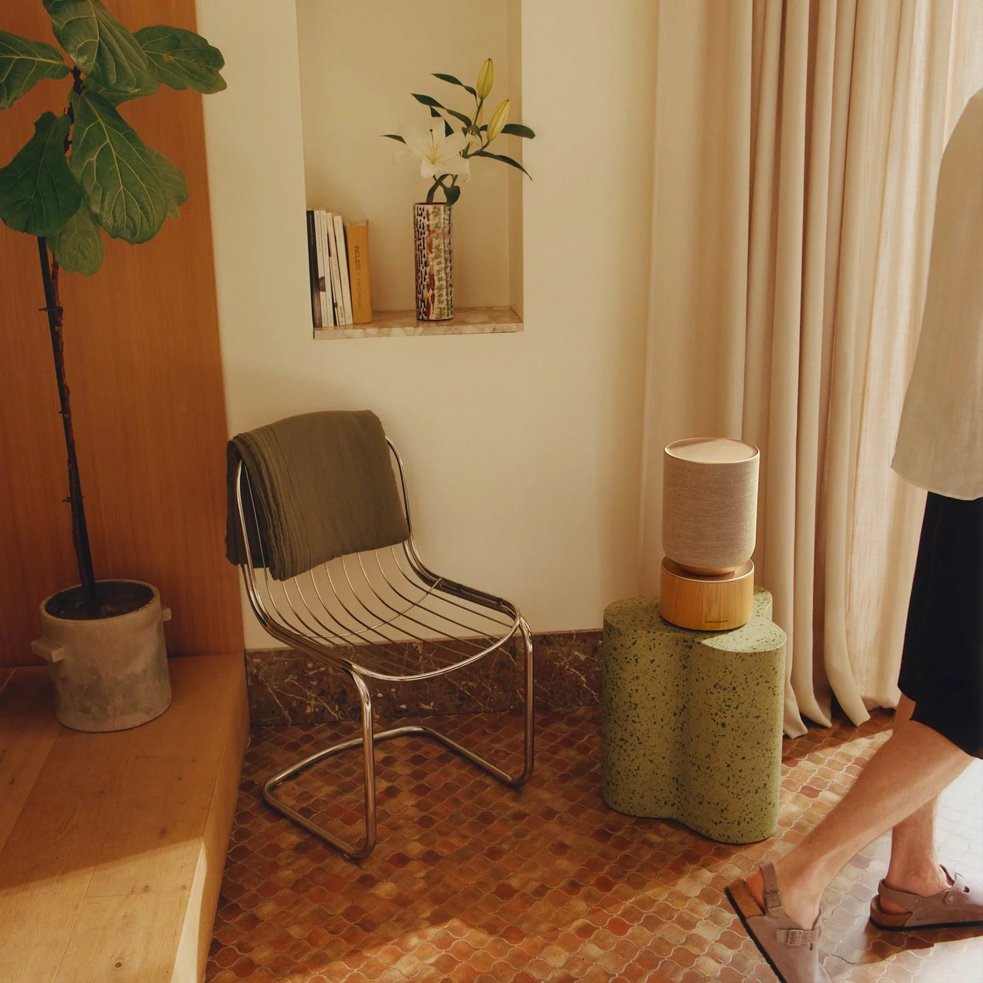 Scandinavian-designed Beosound Balance on a side table.