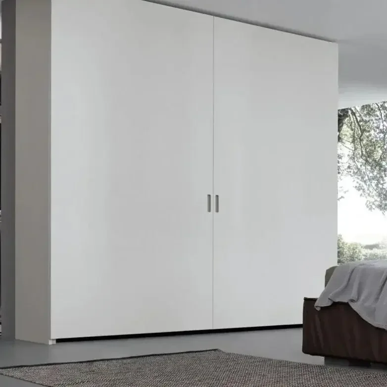 Coplanar Pacific Wardrobe by Giellesse with minimalist sliding doors in modern bedroom.