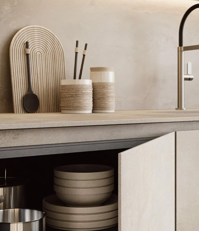 Kitchen countertop in Inalco with modern sink, faucet, and open cabinet, by Zampieri Irori designed and supplied by Abitalia South Coast in Dorset, Hampshire, and Surrey