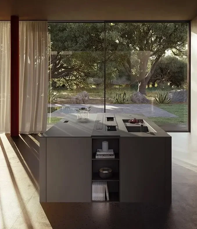 Modern Boffi kitchen island with built-in sink and stovetop designed by Abitalia South Coast in Dorset, Hampshire, and Surrey.