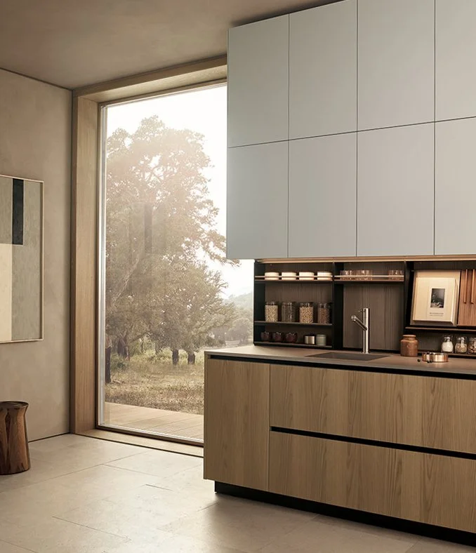 Poliform luxury kitchen with light wood cabinets and open shelving designed by Abitalia South Coast in Dorset, Hampshire, and Surrey