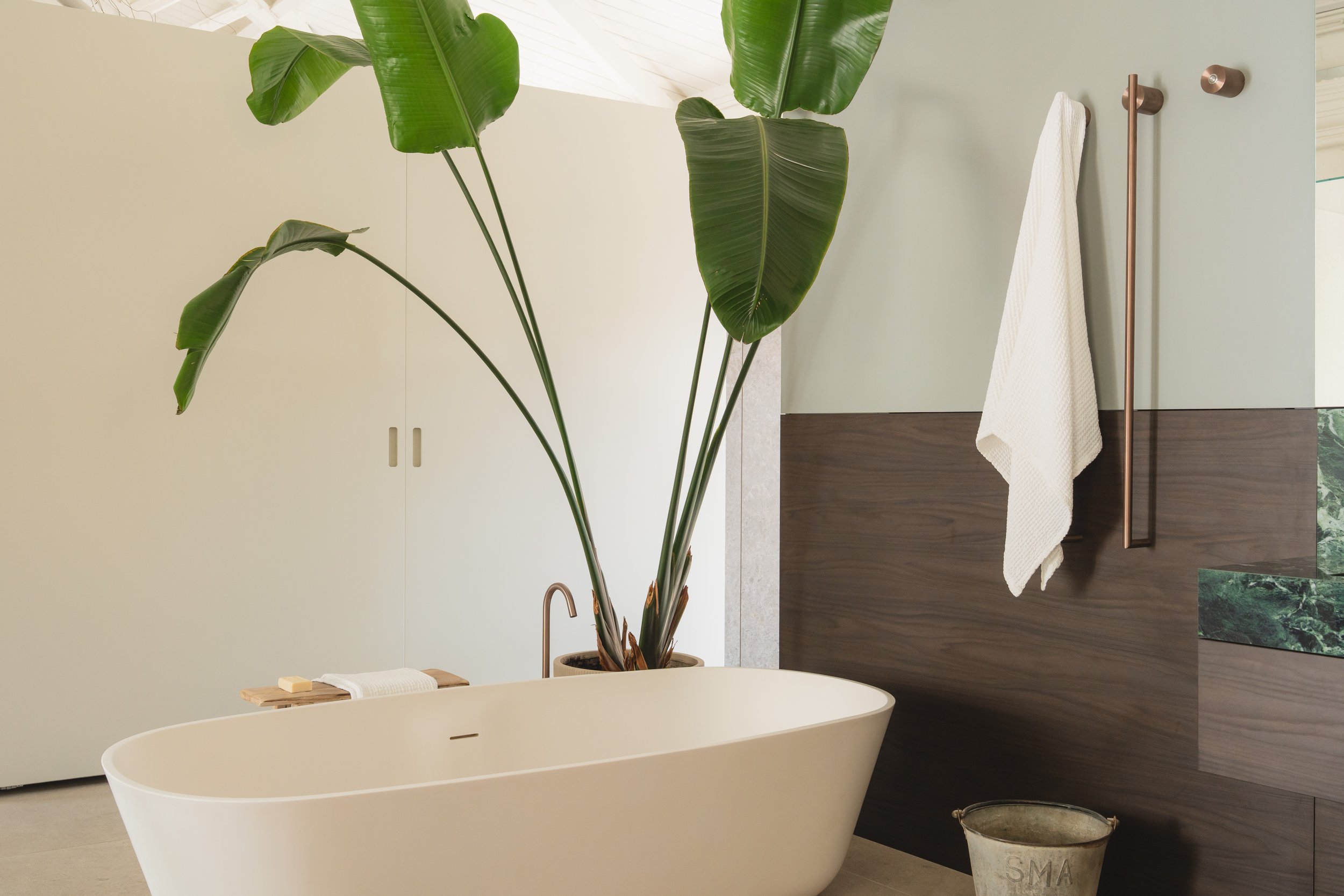 Detail of the oval form against wall and floor surfaces, emphasizing geometric clarity and minimalism.