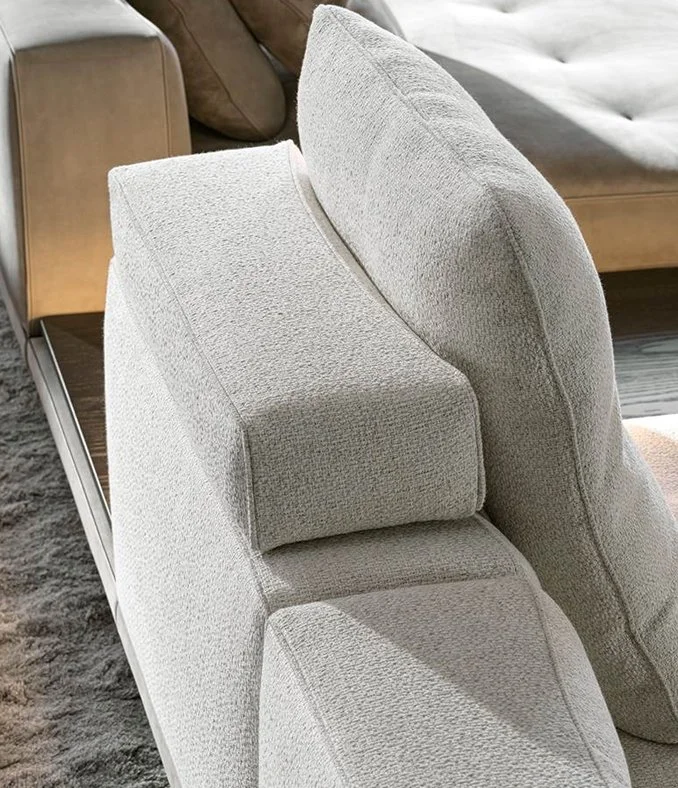 Close-up of Minotti Dylan sofa showing armrest and cushions, supplied by Abitalia South Coast in Dorset, Hampshire, and Surrey, UK.