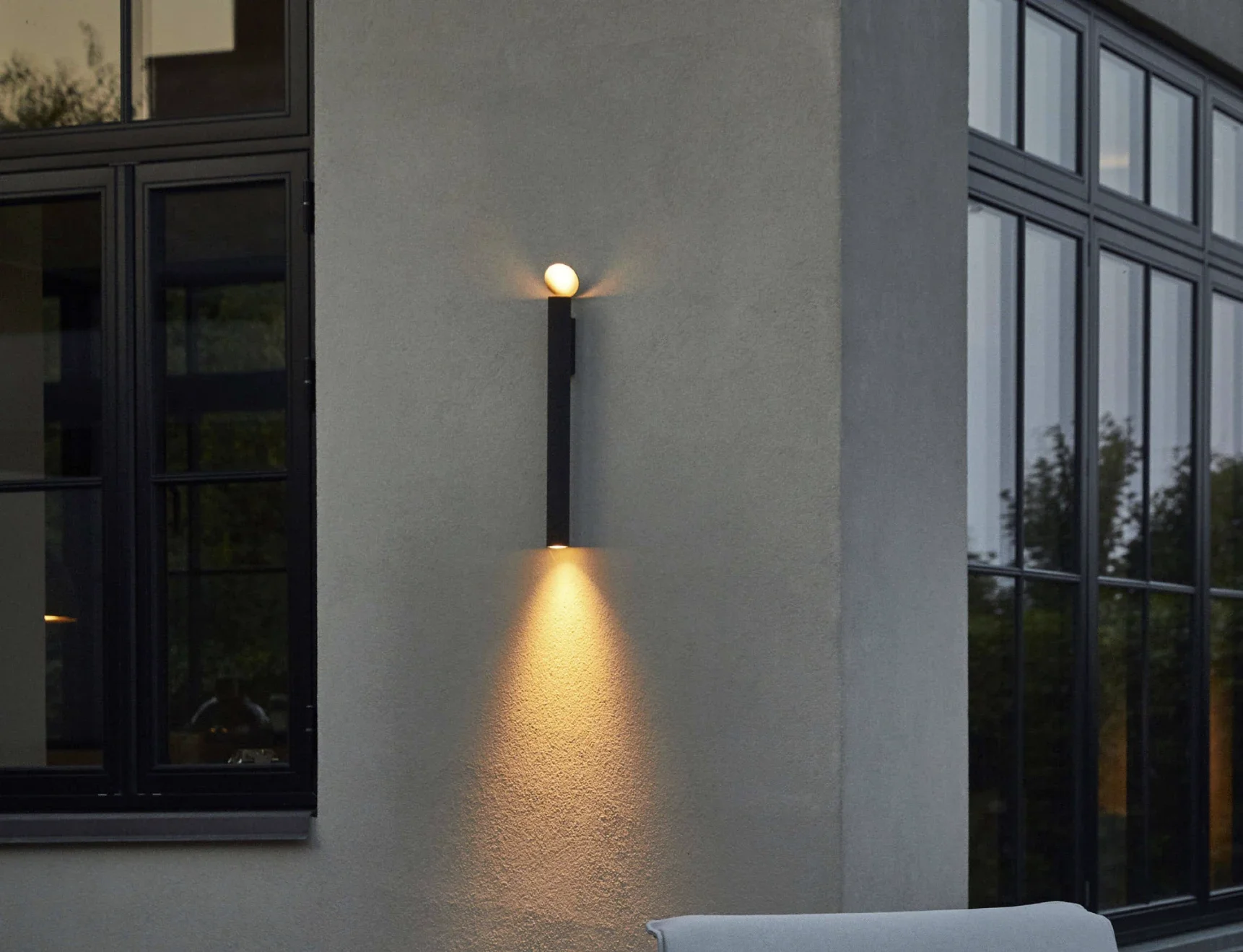 Flos wall light designed to withstand weather while providing ambient illumination.