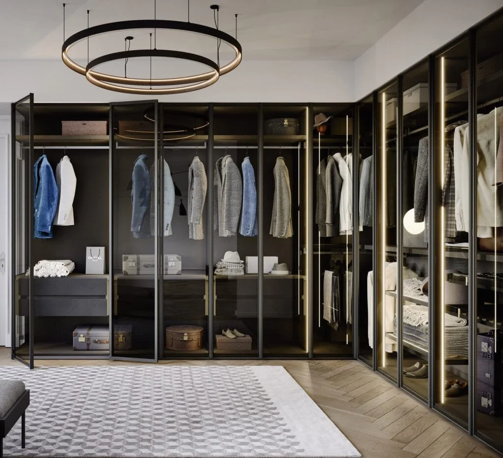 Perry wardrobe by Novamobili with oxidised bronze frame, smoked glass panels, and integrated LED lighting in modern interior.