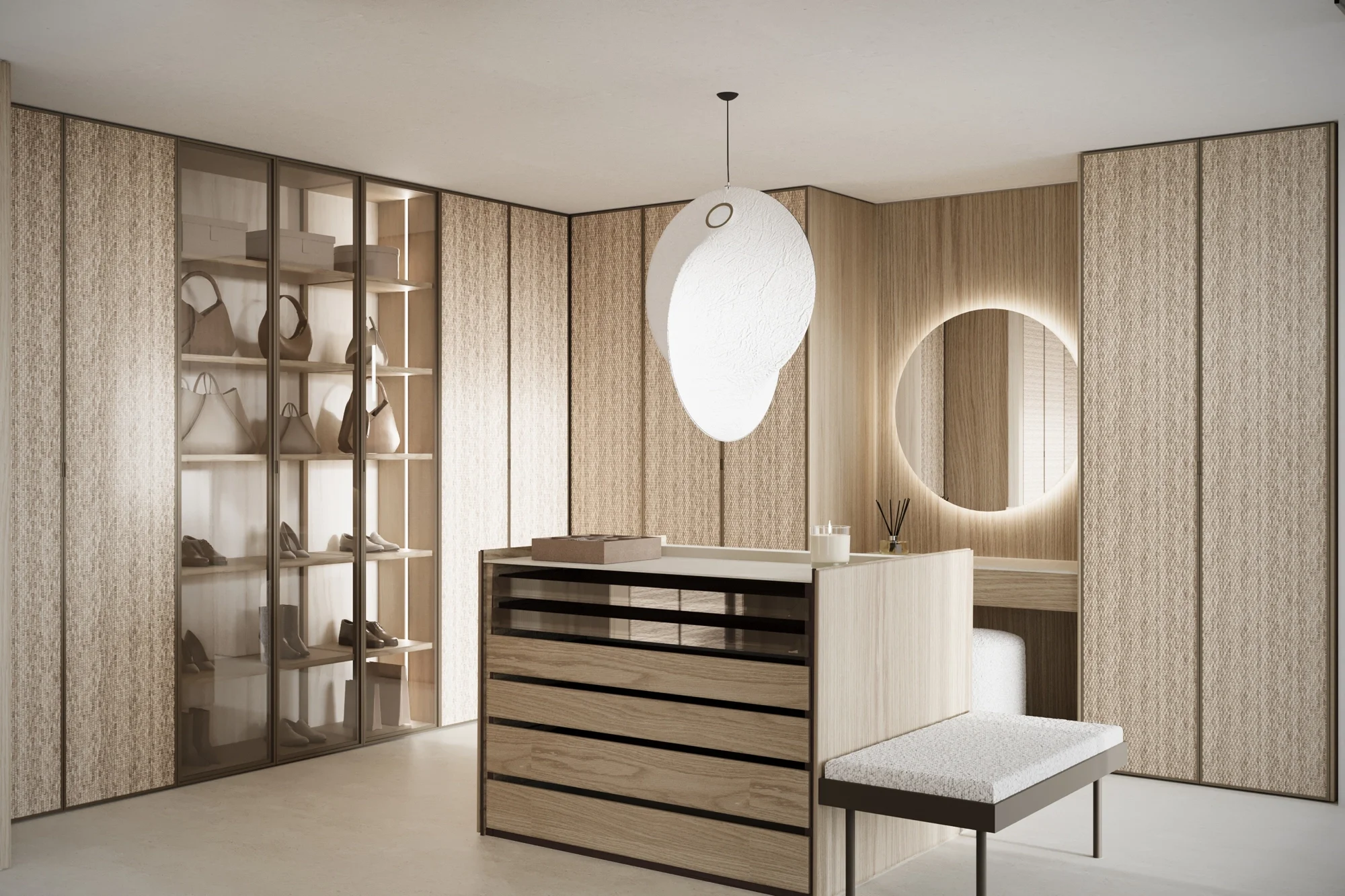 Luxury walk-in closet with island unit, pendant lighting and powder area, bespoke interior design in Dorset by Abitalia South Coast.